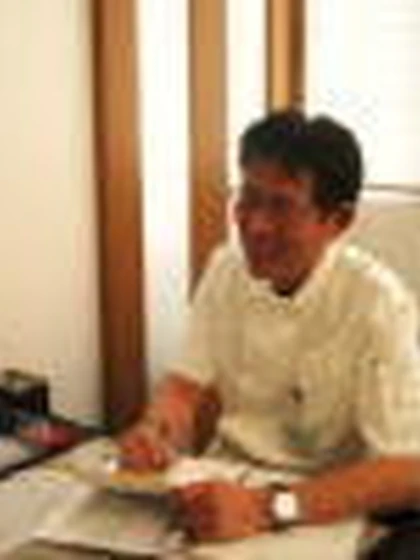 医師 築根 俊明の写真